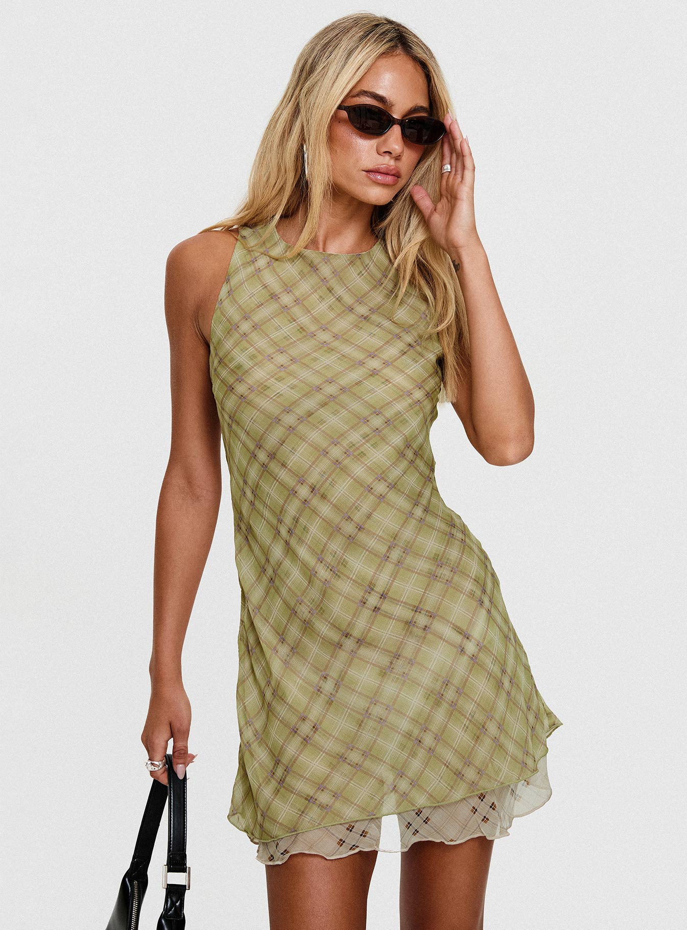side view of model wearing Princess Polly Buffie Shoulder Mini Dress Green Check Crew Neck 