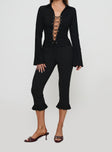 front view of model wearing Princess Polly Alexandar Long Sleeve Top Black Full Sleeves V-Neck 