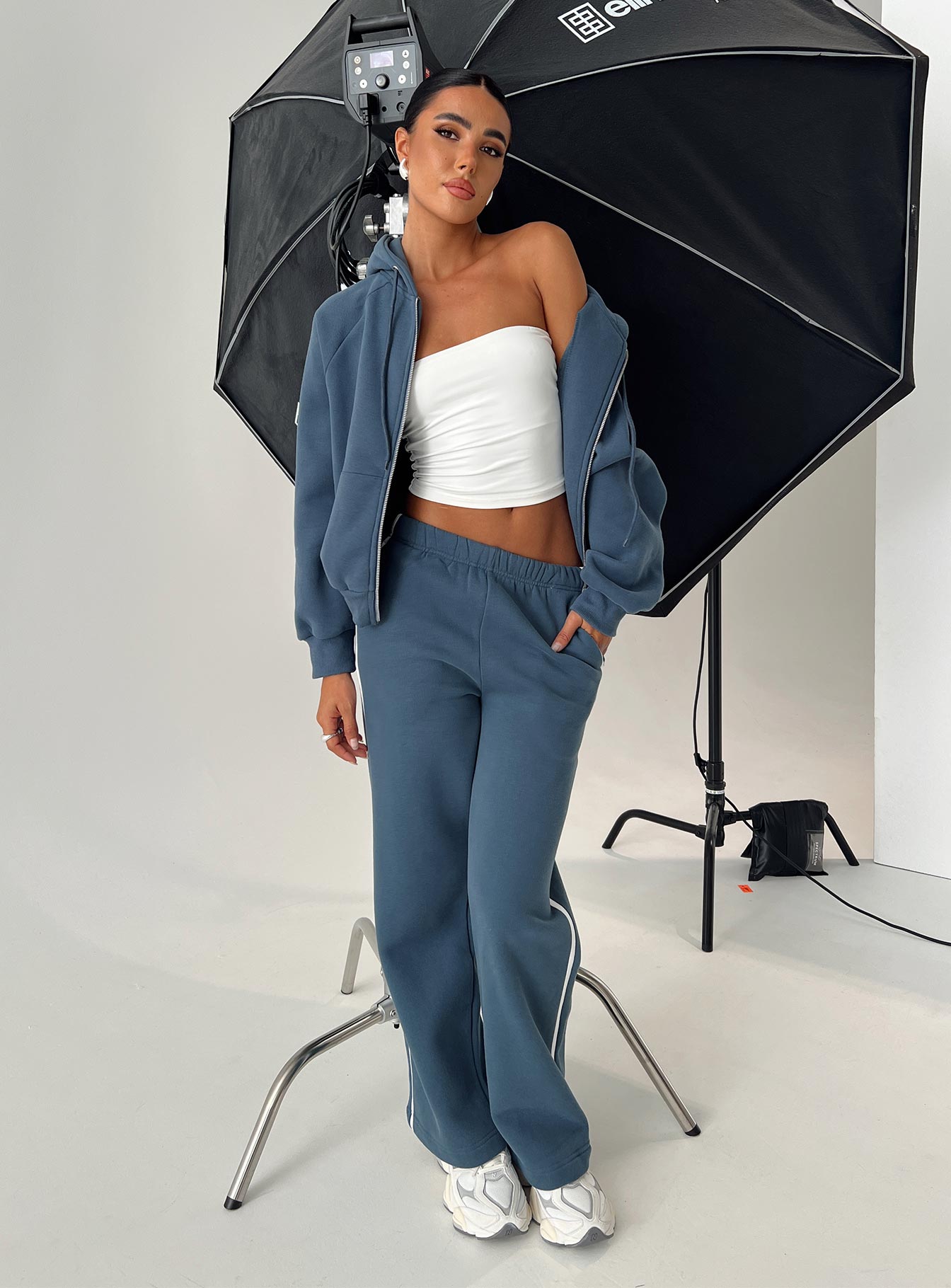 front view of model wearing Princess Polly Skiller Side Stripe Track Pants Navy High Waisted Pants 