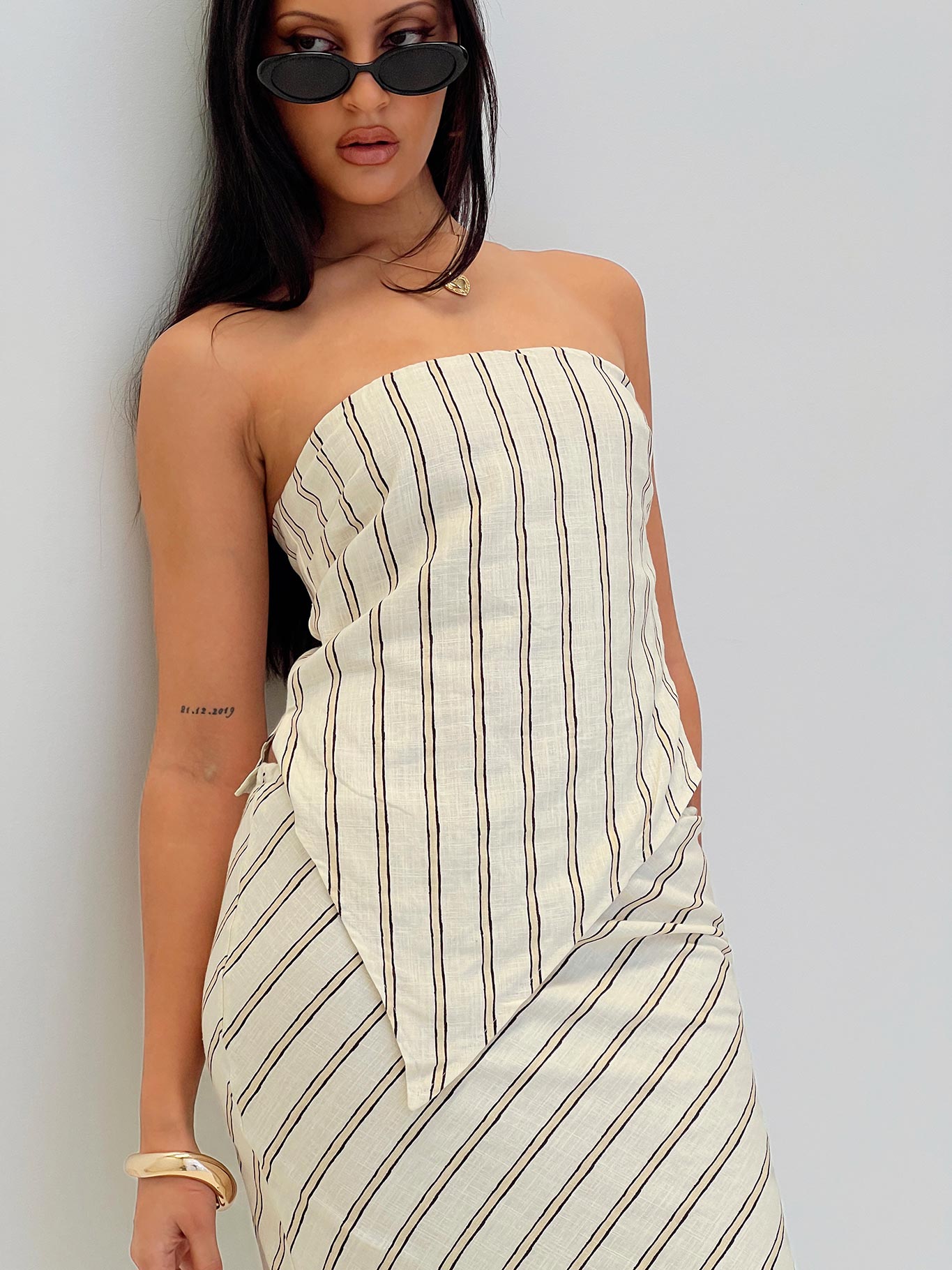 side view of model wearing Princess Polly Birdie Asymmetric Linen Blend Top Cream Sleeveless straight 