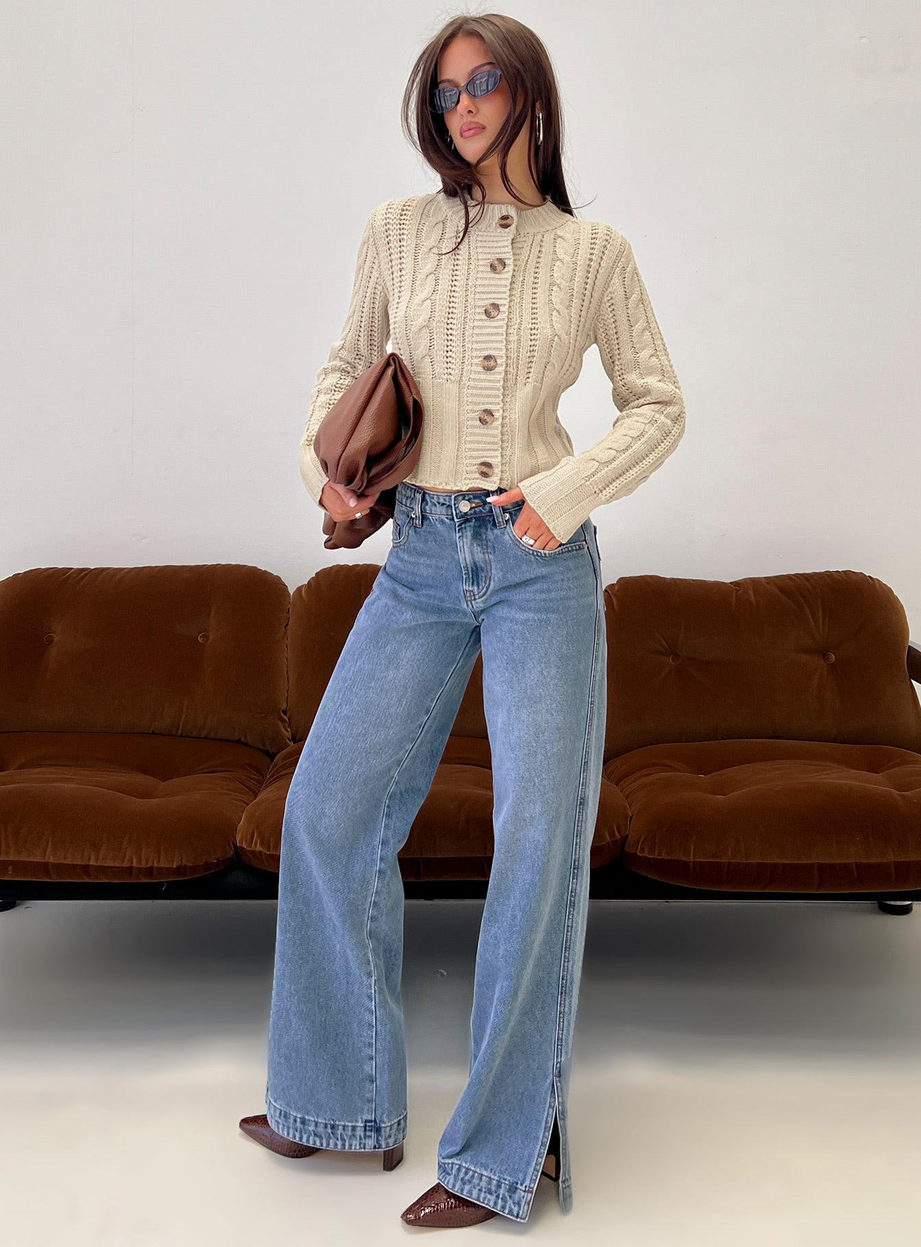 front view of model wearing Princess Polly Donielle Cable Knit Cardigan Beige cropped 