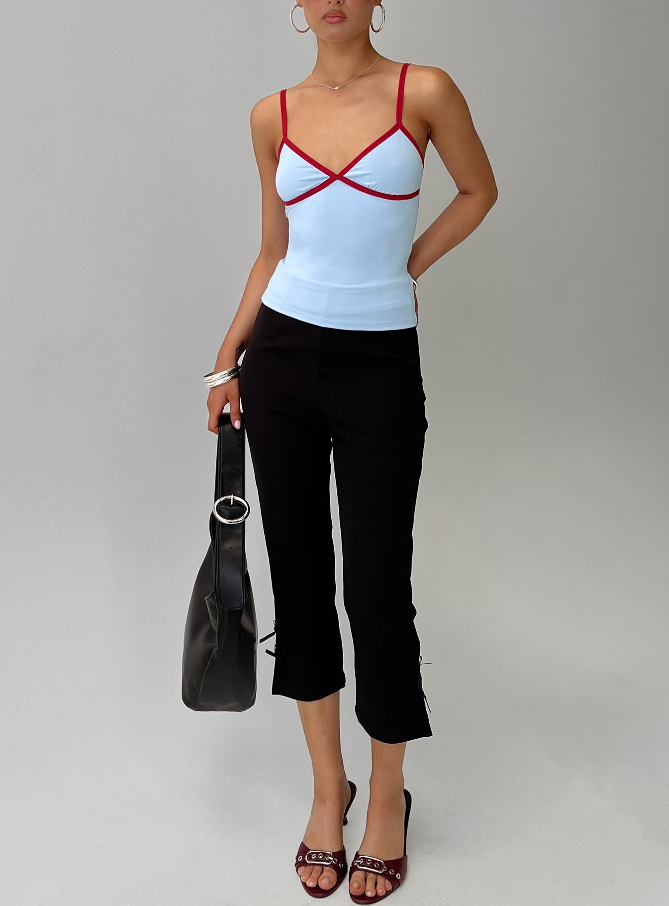 front view of model wearing Princess Polly Tiera Top Blue / Red Sleeveless V-Neck 
