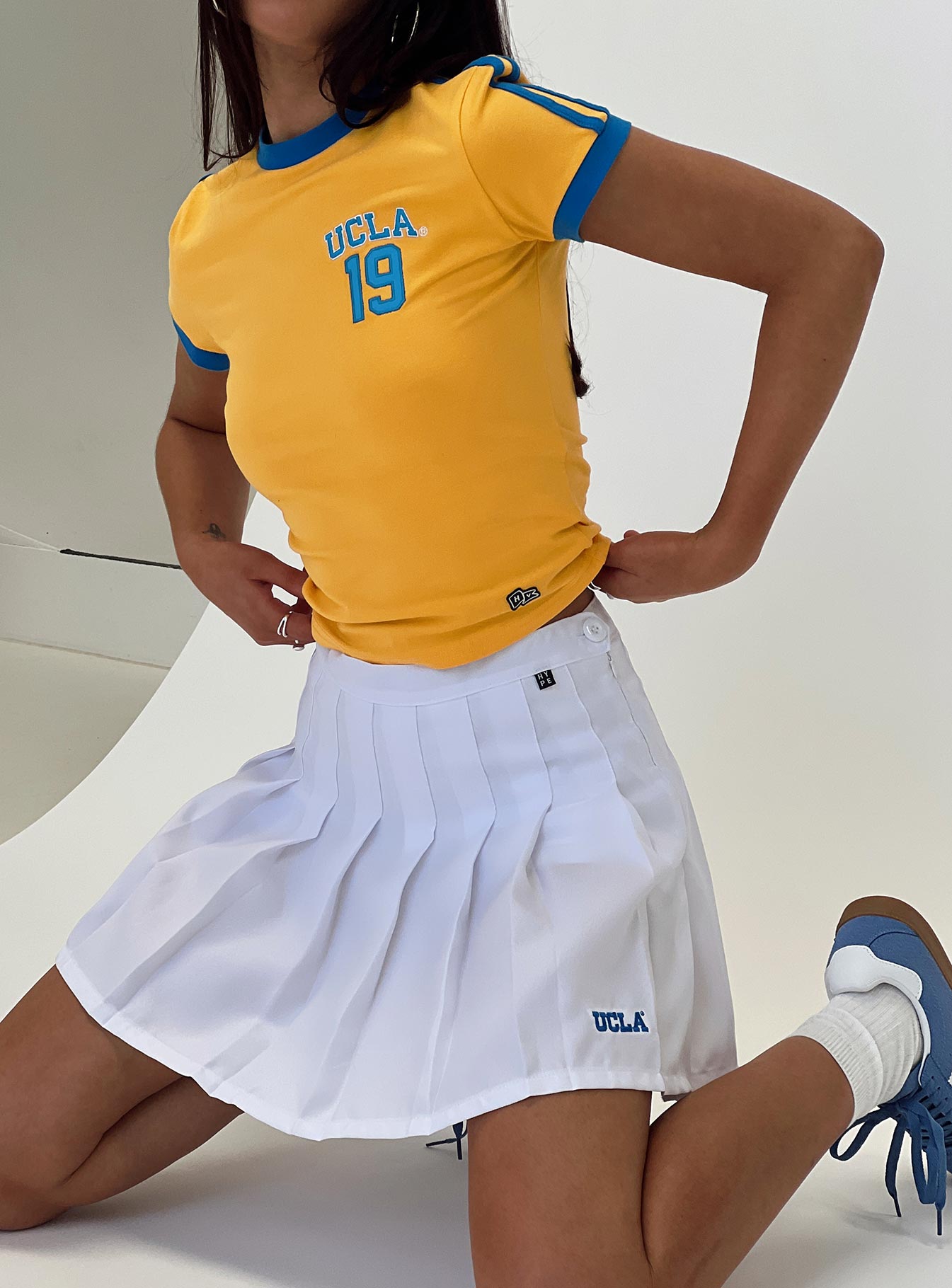 front view of model wearing Princess Polly UCLA Goalie Baby Tee Yellow Short Sleeves Crew Neck 