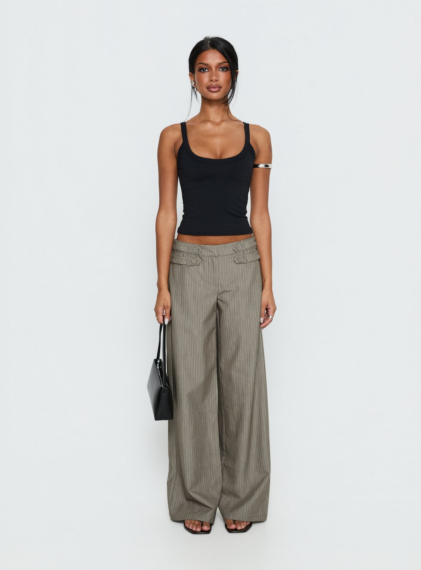 side view of model wearing Princess Polly Jette Tailored Buckle Pant Taupe Pinstripe Mid Rise Pants 