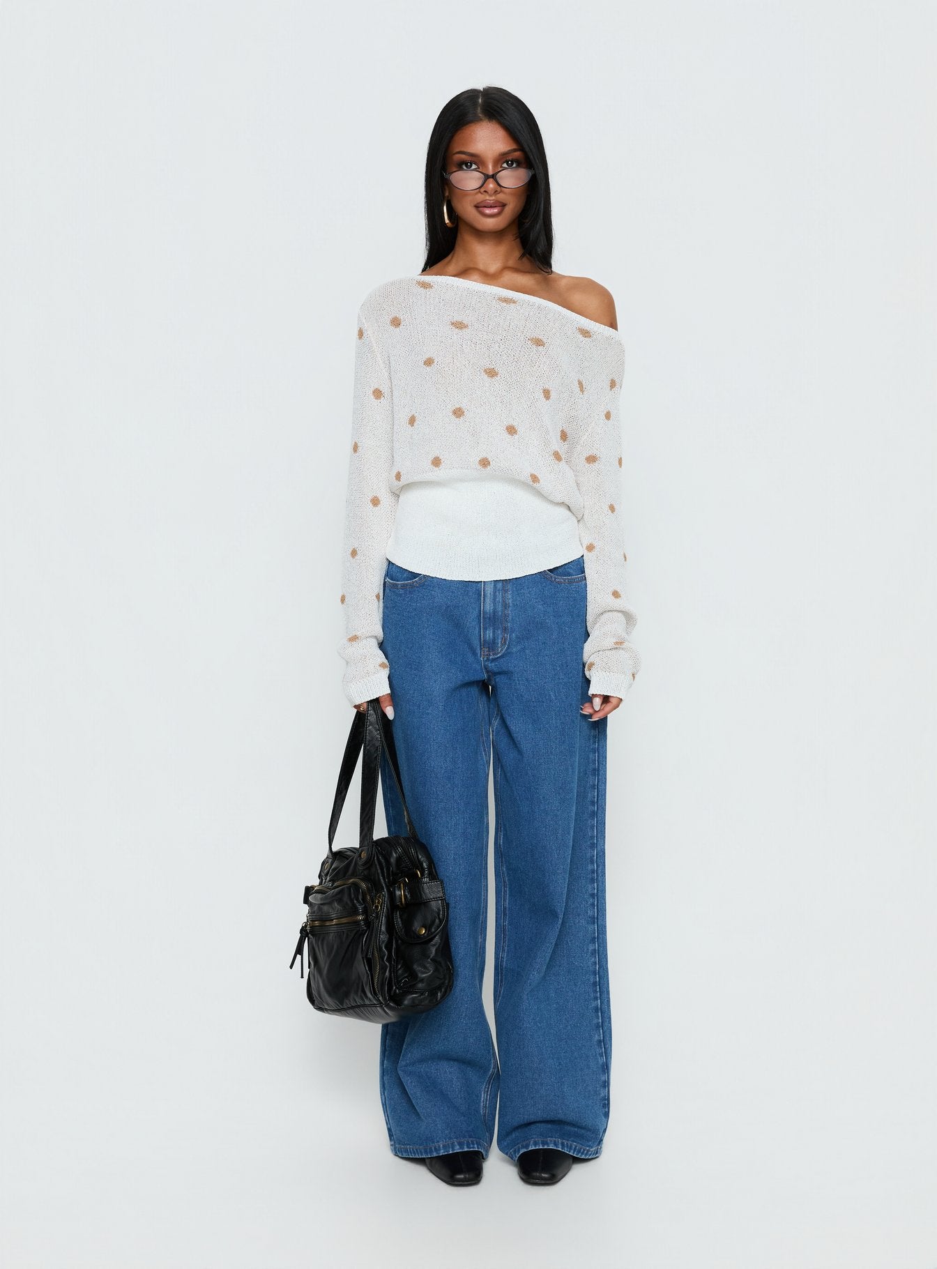 side view of model wearing Princess Polly Harvy Off Shoulder Knit Sweater White Polka regular 