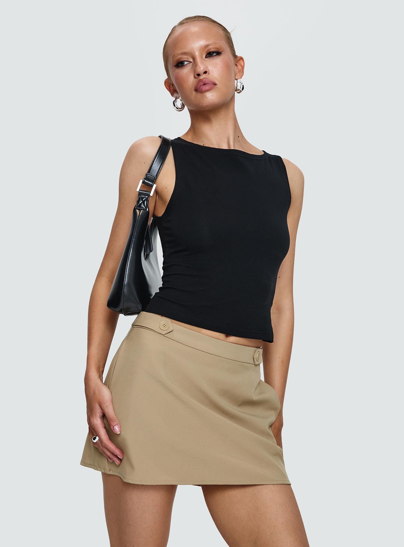   side view of model wearing Princess Polly Hosier Twill Mini Skirt Taupe Mini Skirts 