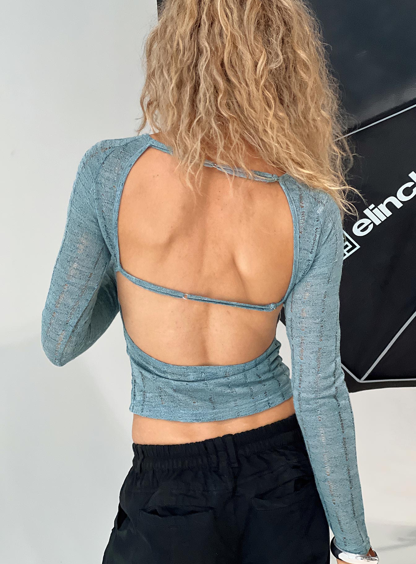 back view of model wearing Princess Polly Oriton Long Sleeve Top Blue Full Sleeves Crew Neck 