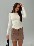 front view of model wearing Princess Polly Arnim Long Sleeve Top Cream Full Sleeves Crew Neck 