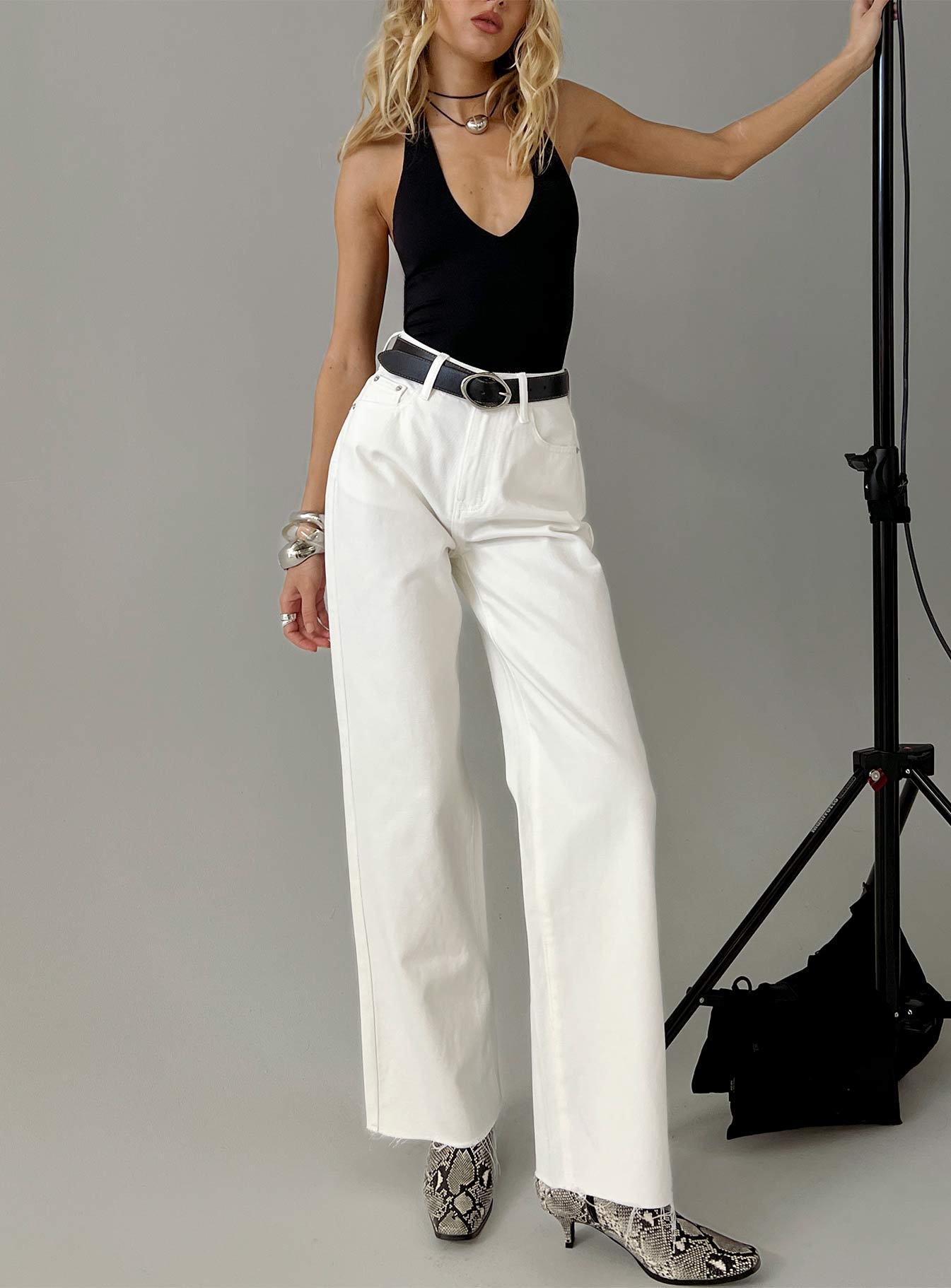 front view of model wearing Princess Polly Henesey High Rise Straight Leg Jeans White Wash High Waisted Jeans 