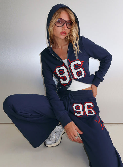 front view of model wearing Princess Polly Kari Distressed Zip Through Top Navy Multi Longline Jumpers 