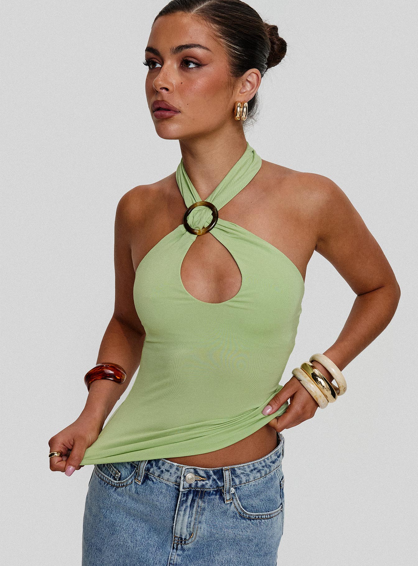 back view of model wearing Princess Polly Quell Top Green Sleeveless High Neck 