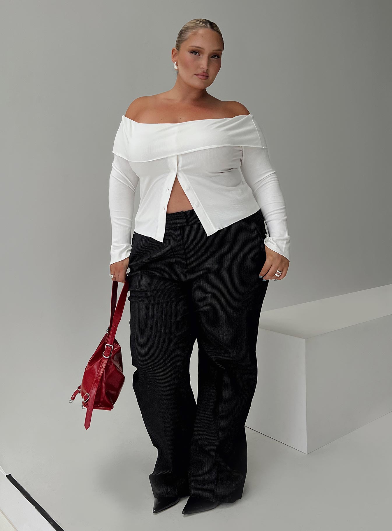 side view of model wearing Princess Polly Jeller Pinstripe Pants Black Curve High Waisted Pants 