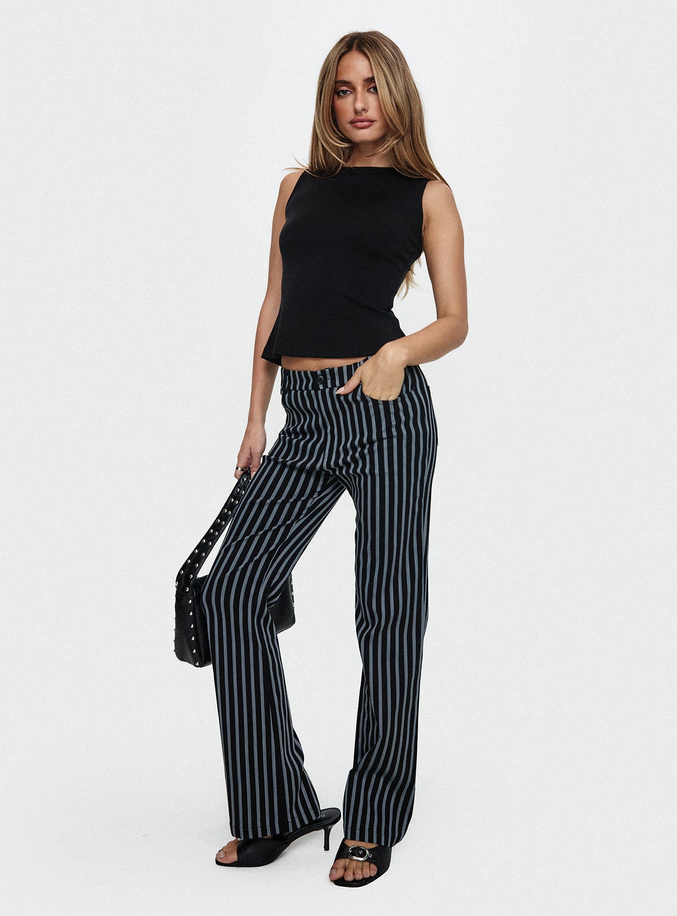 front view of model wearing Princess Polly Allude Low Waist Pinstripe Pant Black Low Rise Pants 