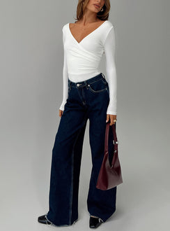 front view of model wearing Princess Polly Right Here Cross Detail Bodysuit White Long Sleeve Tops 