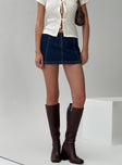 front view of model wearing Princess Polly Lemoni Skort Denim Mid Wash High Waisted Shorts 