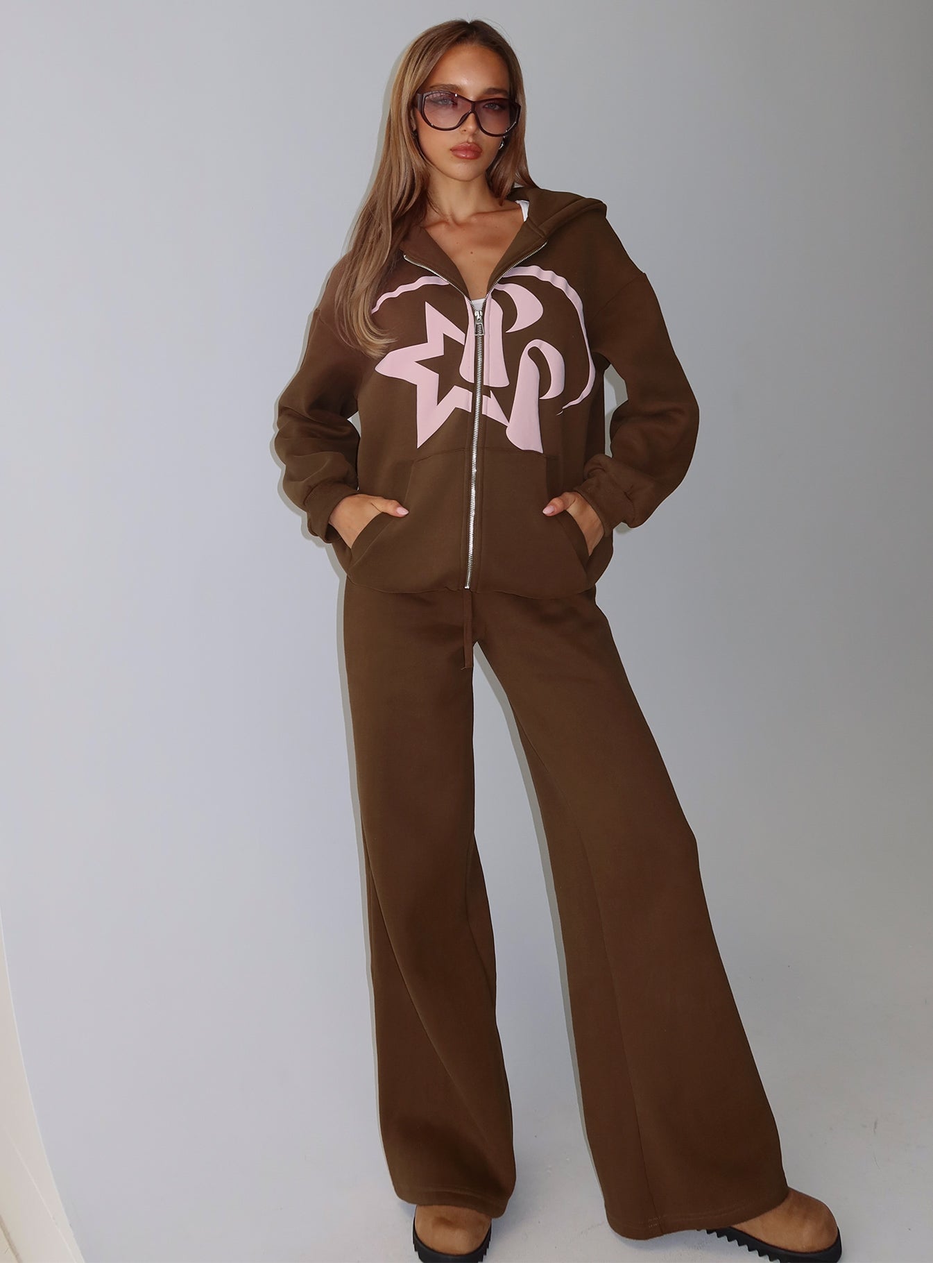 front view of model wearing Princess Polly Princess Polly Stargirl Zip Through Jumper Brown Longline Jumpers 