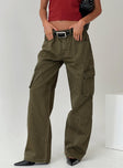 side view of model wearing Princess Polly Ahstin Cargo Jeans Green Petite Mid Rise 