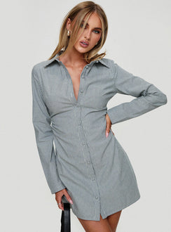 side view of model wearing Princess Polly Publicity Long Sleeve Mini Dress Blue Pinstripe V-Neck 