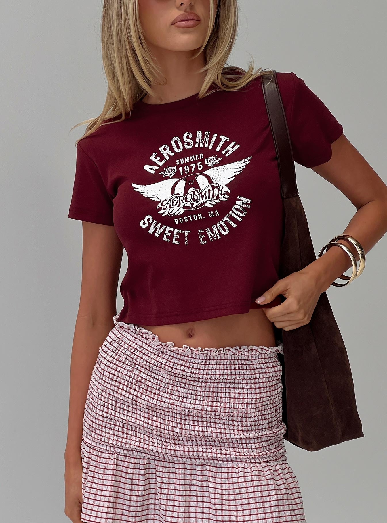 front view of model wearing Princess Polly Aerosmith Vintage Graphic Top Burgundy Short Sleeves Crew Neck 