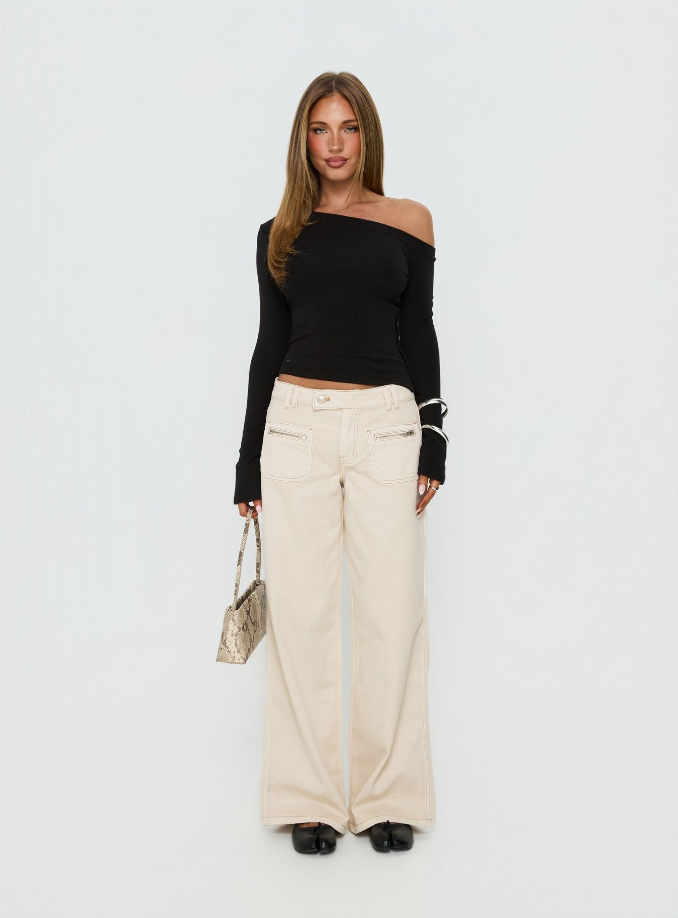 front view of model wearing Princess Polly Lifetimes Mid Rise Wide Leg Cargo Jeans Cream Mid Rise Jeans Jeans 