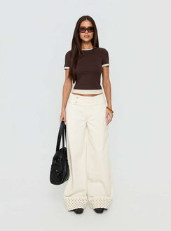 Featuring the Nikoletta Foldover Jeans Cream / Polka Petite womens-jeans in high-rise front view of model wearing Princess Polly