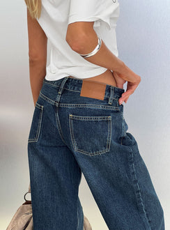 back view of model wearing Princess Polly Serenitia Mid Rise Straight Leg Relaxed Jeans Dark Blue Wash Mid Rise Jeans 