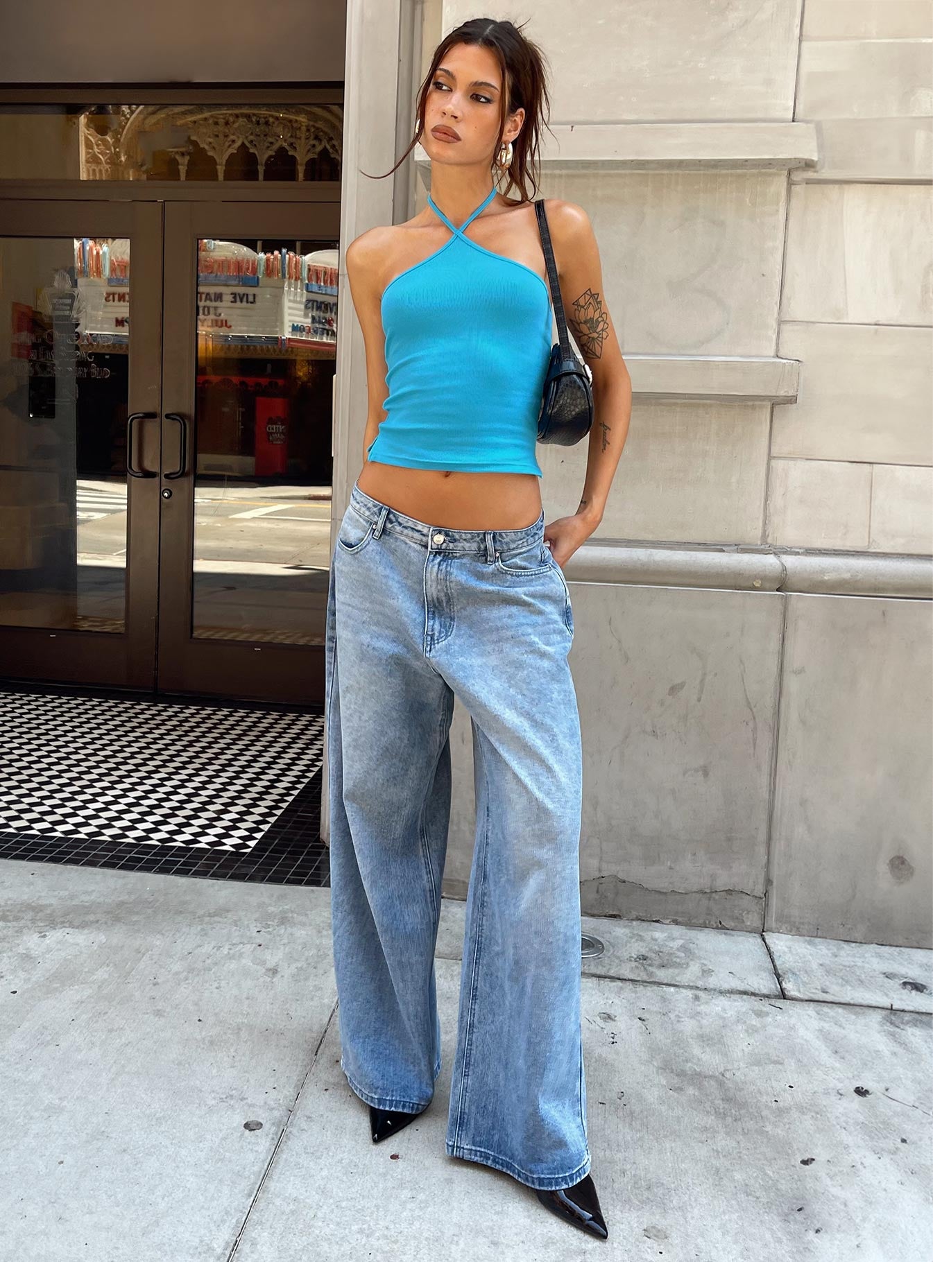 front view of model wearing Princess Polly Baseline Halter Rib Top Blue Sleeveless 