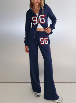 front view of model wearing Princess Polly Kari Distressed Patch Track Pant Navy Multi High Rise Pants 