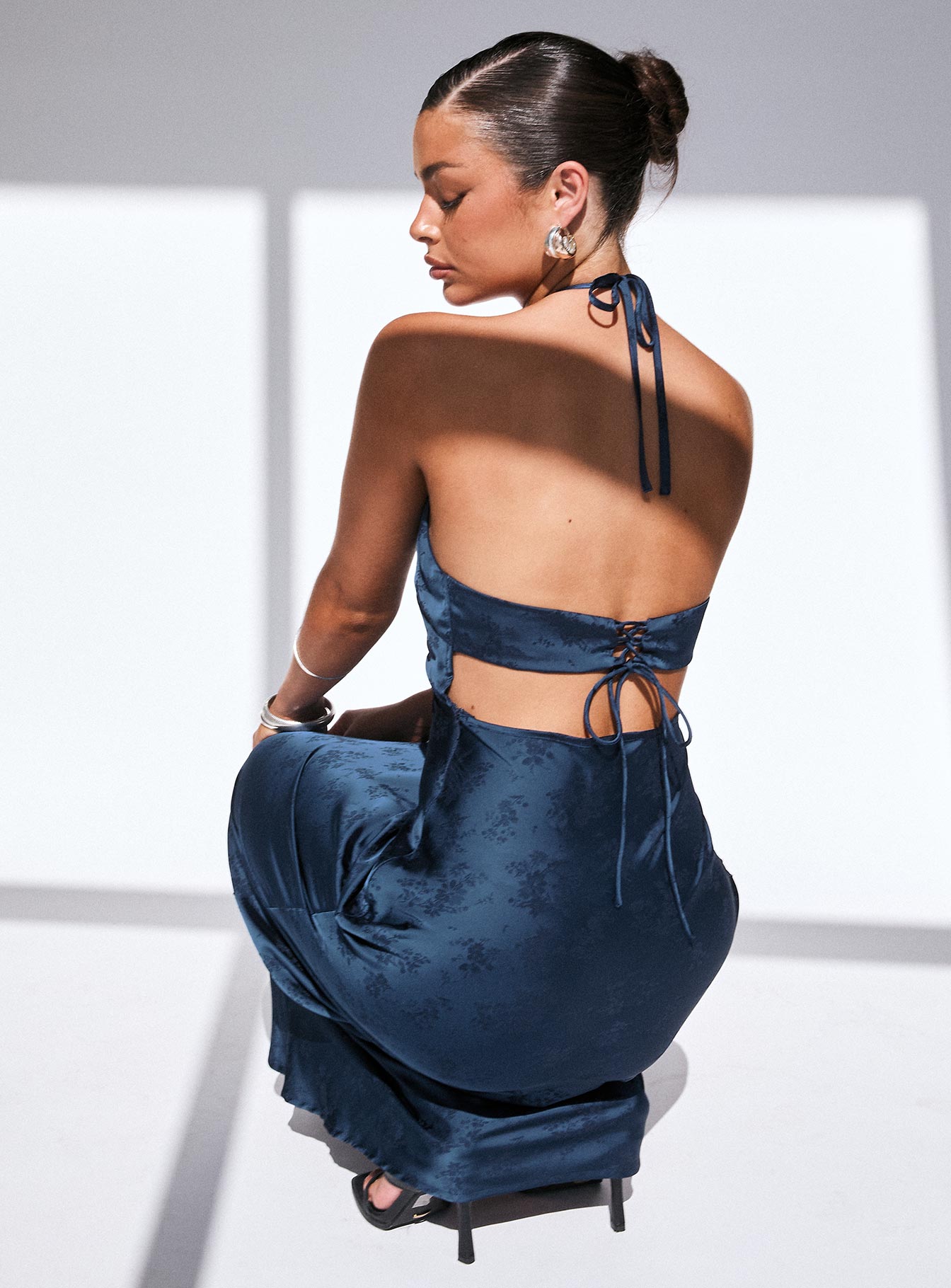 back view of model wearing Princess Polly Limosina Halter Maxi Dress Navy Plunger 