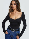 front view of model wearing Princess Polly Peekaboo Long Sleeve Bodysuit Black Full Sleeves 