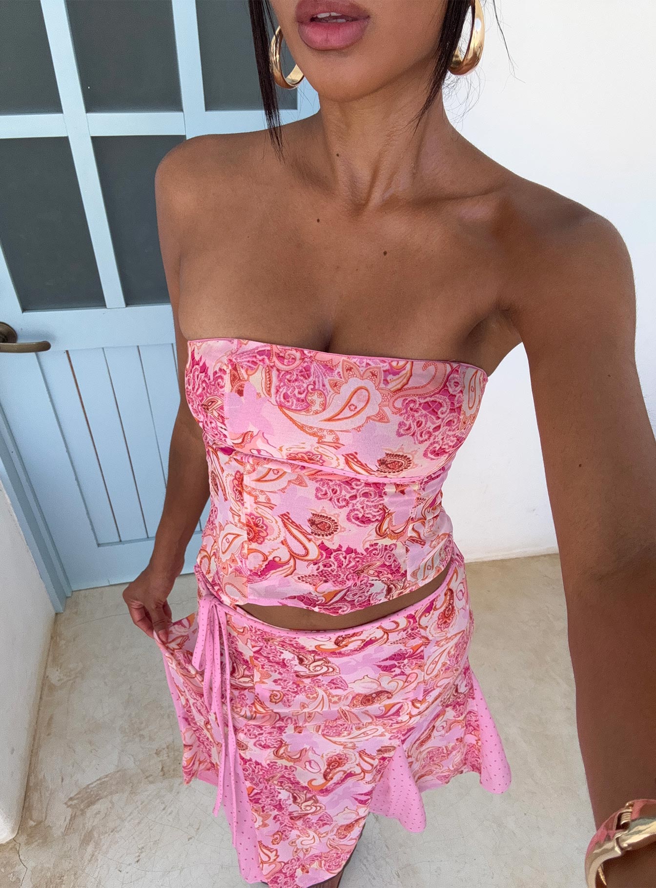 front view of model wearing Princess Polly Tipsy Strapless Top Pink Paisley Sleeveless straight 