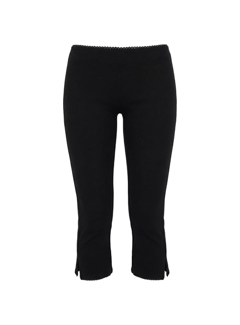 side view of model wearing Princess Polly Baseline Rib Capri Pants Black Petite Mid Rise Pants 