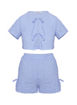 Matching set Blouse top, relaxed fit, twin tie fastening at front High-rise shorts, relaxed fit, elasticated band at waist, tie detail at sides Non-stretch material, fully lined 