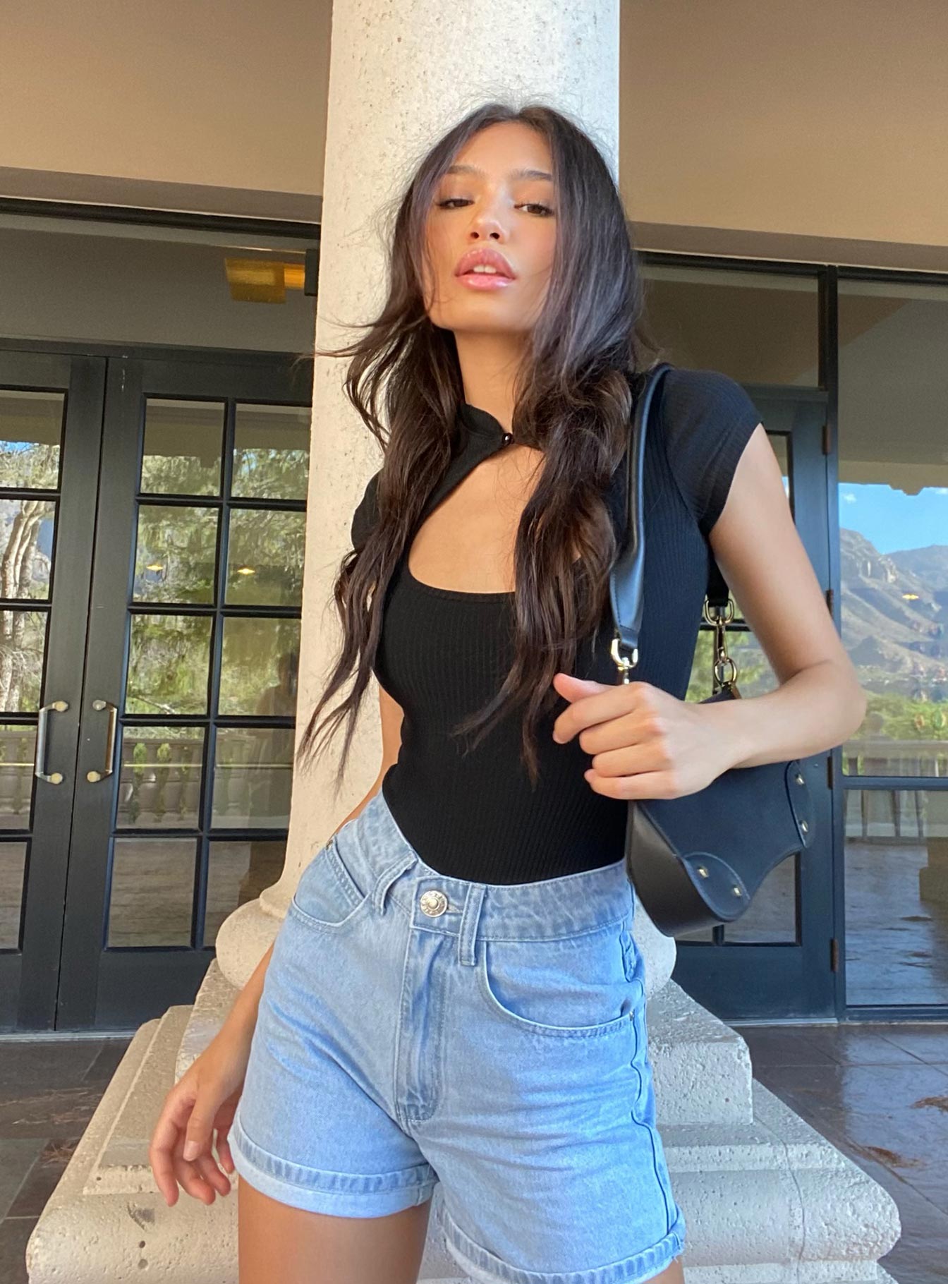 side view of model wearing Princess Polly The Swalla Shorts Light Blue Lower Impact High Waisted Shorts 