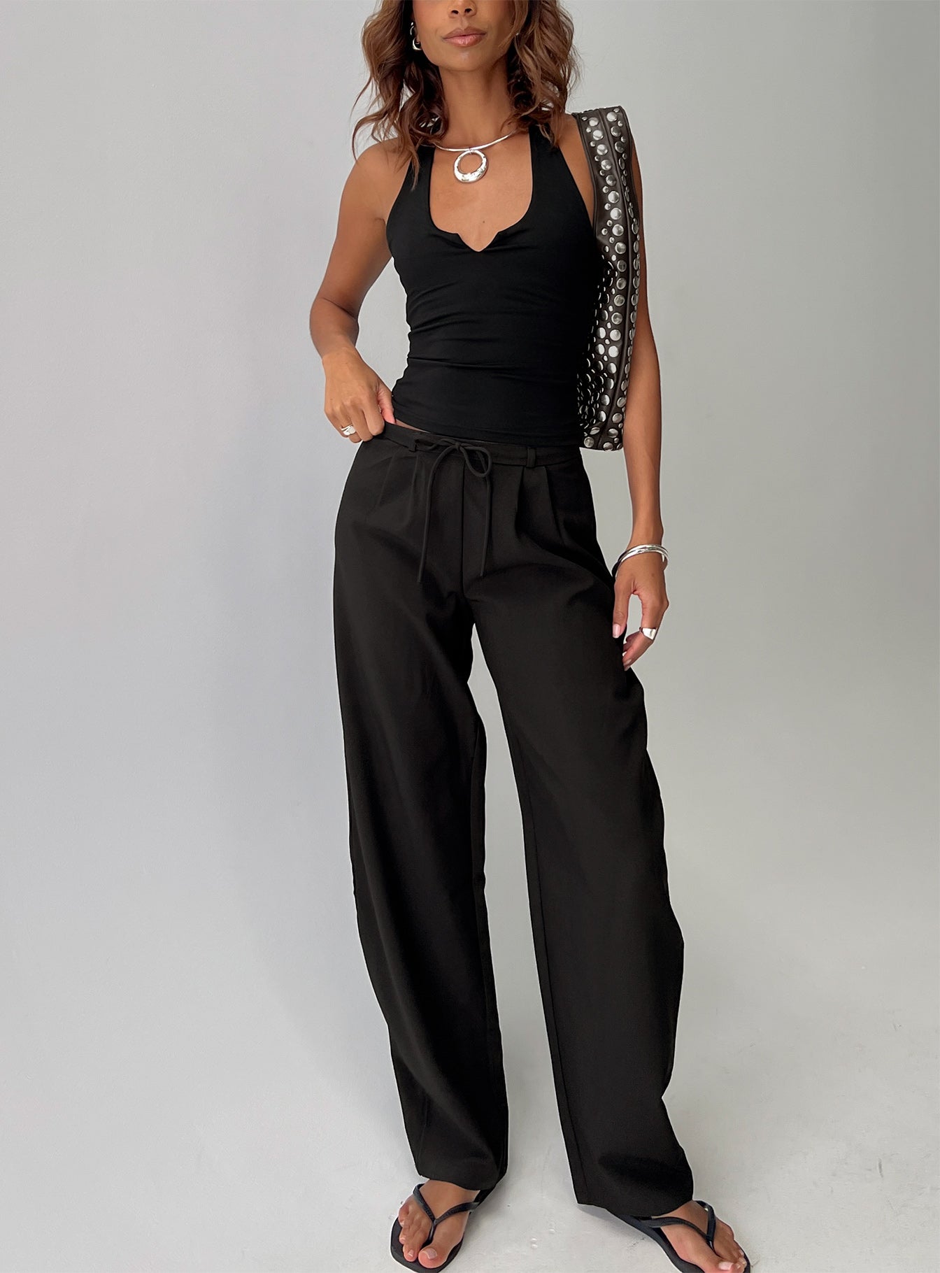 front view of model wearing Princess Polly Triffid Barrel Leg Pants Black High Rise Pants 