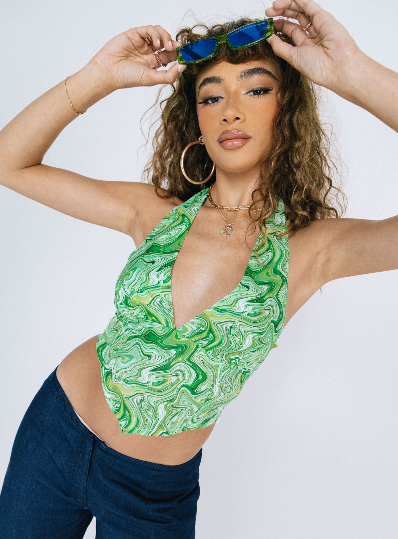 side view of model wearing Princess Polly Clarkefield Top Green Sleeveless Plunger 