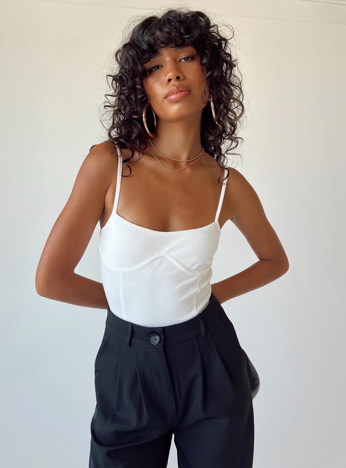 front view of model wearing Princess Polly Allred Bodysuit White Sleeveless Square Neck 