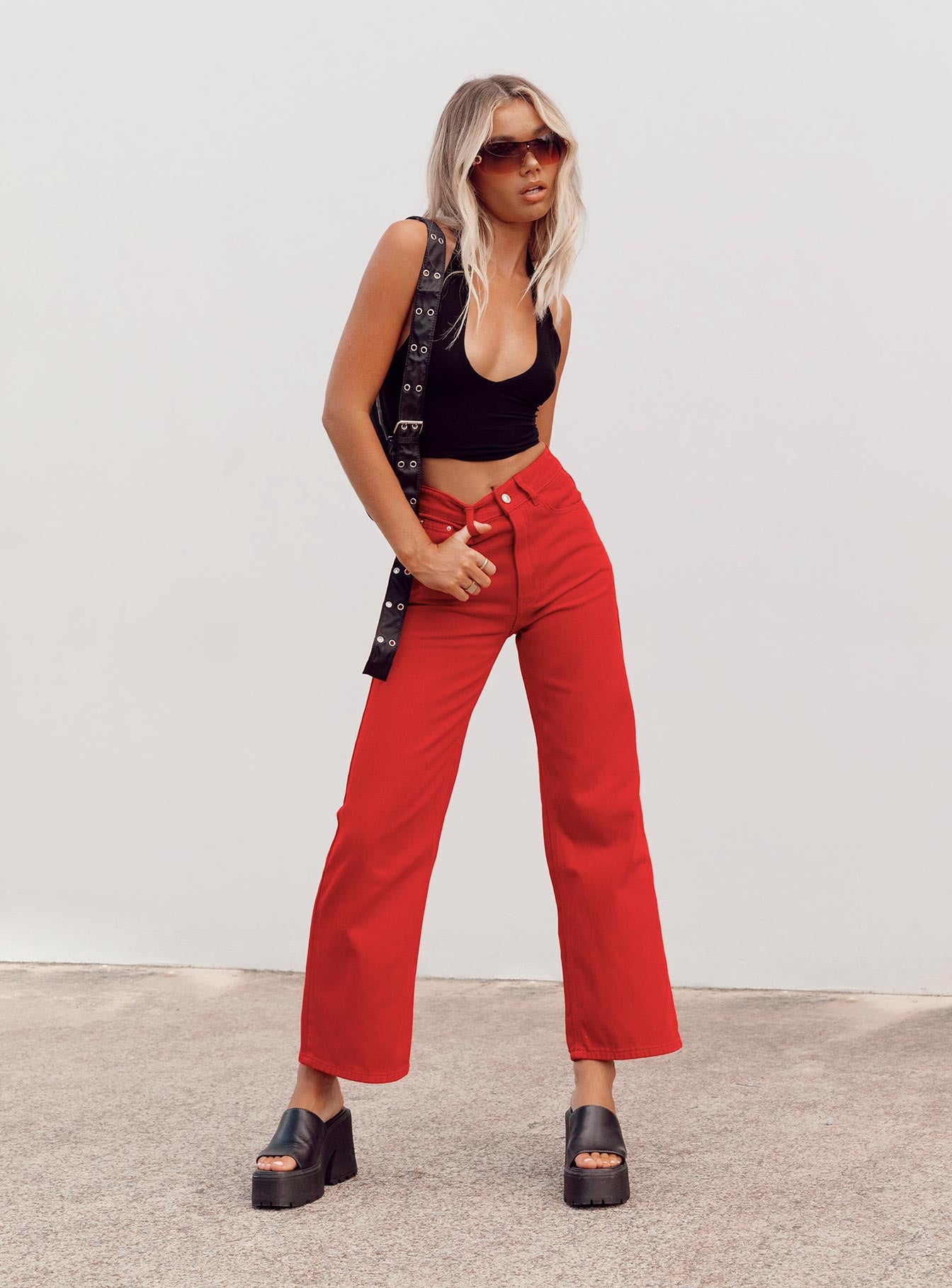 side view of model wearing Princess Polly Denver Denim Jeans Red Mid Rise 