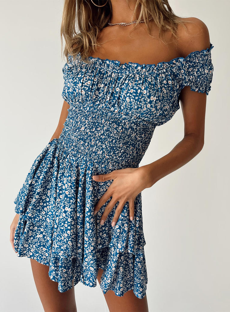 Blue romper Floral print  Shirred waistband Ruffle detailing Elasticated neck & sleeves Can be worn on or off-shoulder Layered ruffle hem