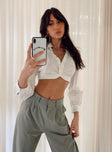 White cropped shirt Linen look material  Classic collar  Button front fastening  Cropped design  Elasticated waistband at back  Single button cuff  slightly sheer