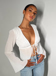 Long sleeve top Sheer pleated material V-neckline Tie fastening at bust Flared sleeves