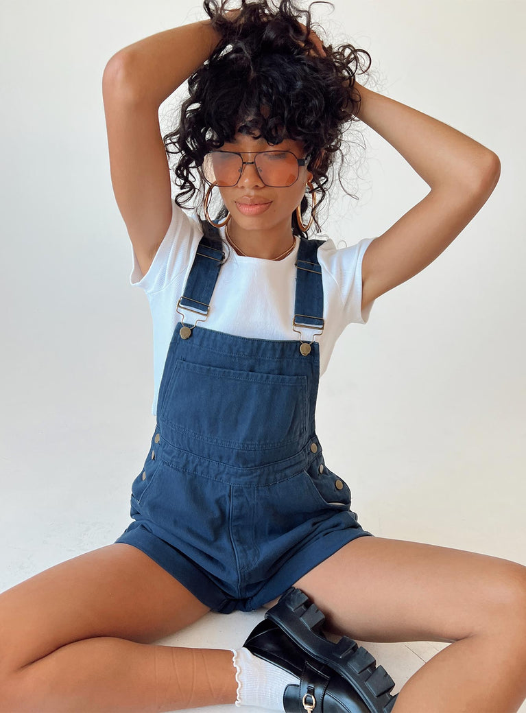 Overalls Denim material Adjustable buckle straps Button fastening at sides Large chest pocket Classic four pockets  Gold-toned hardware  Fixed rolled hem
