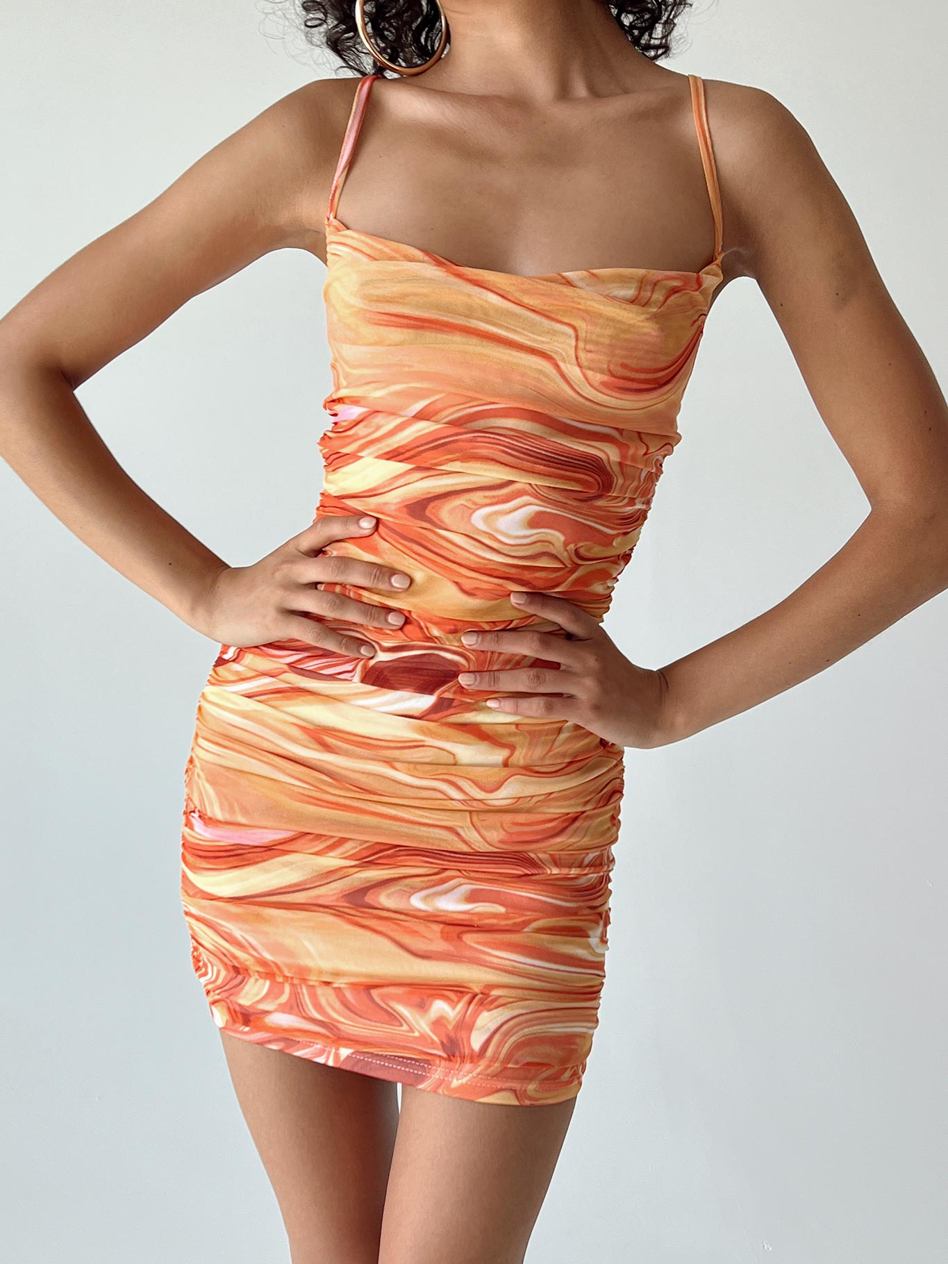 back view of model wearing Princess Polly Harlan Mini Dress Orange Multi Cowl Neck 