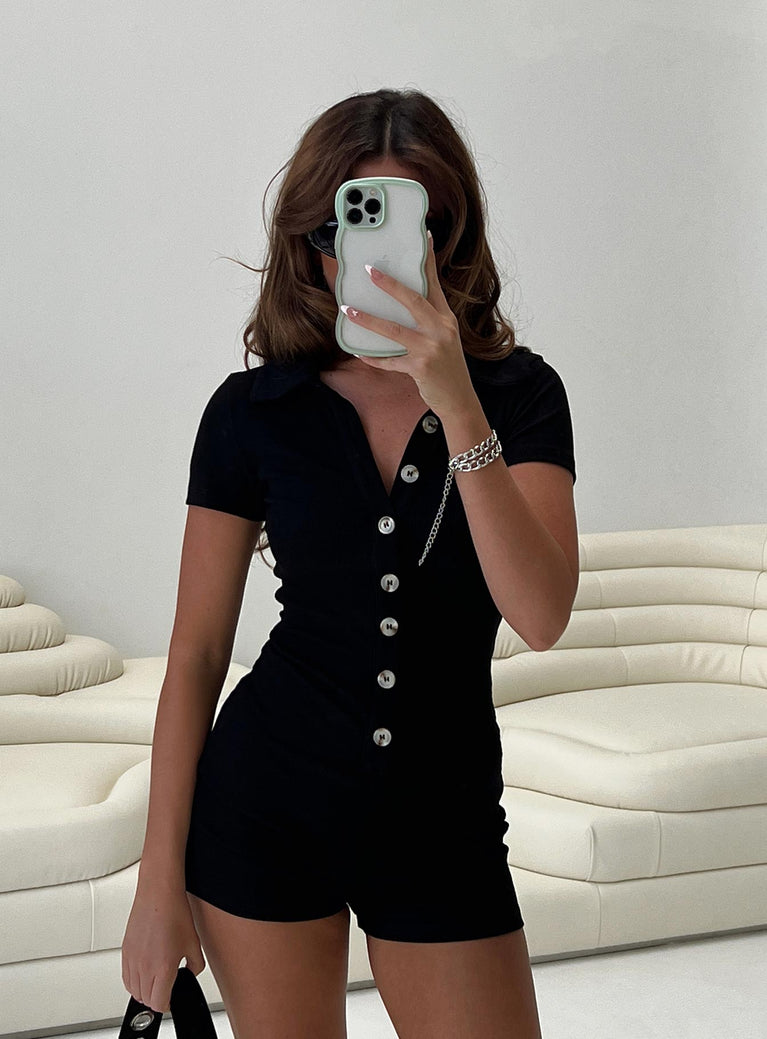 Black romper Ribbed material Button front fastening Pointed collar Short capped sleeves Good stretch Unlined