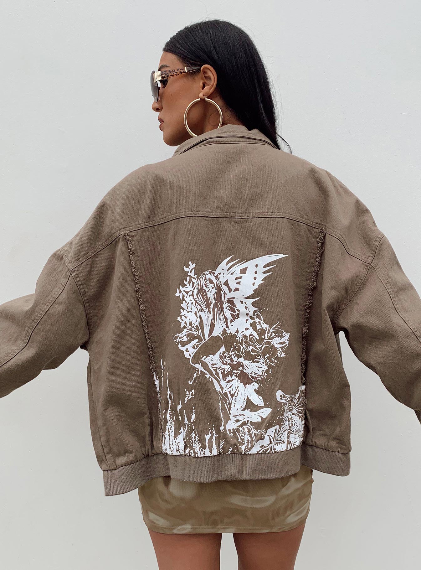 Bomber jacket Denim look material  Graphic print on back  Frayed detail  Classic collar  Zip front fastening  Drop shoulder 