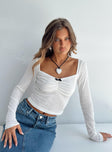 Long sleeve top Soft knit material Sweetheart neckline Contrast bow detail at front Good Stretch