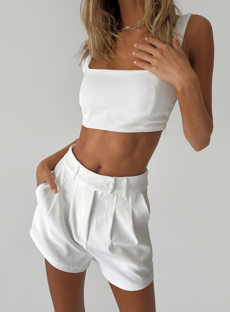 White matching set Crop top  Invisible zip fastening at side  High waisted shorts  Zip & button fastening  Belt looped waist  Twin hip pockets  Pleated design 