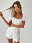 White romper Elasticated shoulders  Puff sleeves  Gathered bust  Lace up waist  Invisible zip fastening at back 