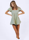 Green romper Muslin material Square neckline  Elasticated puff sleeves Shirred back panel Invisible zip fastening at back  Relaxed leg 