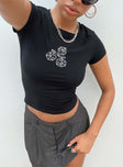 Front view of model wearing  front Princess Polly Short Sleeves High Neck  Roll The Dice Top Tee Black